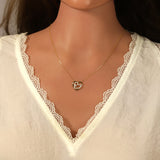 Collier double coeur en plaqué or avec zirconiums 755Z350