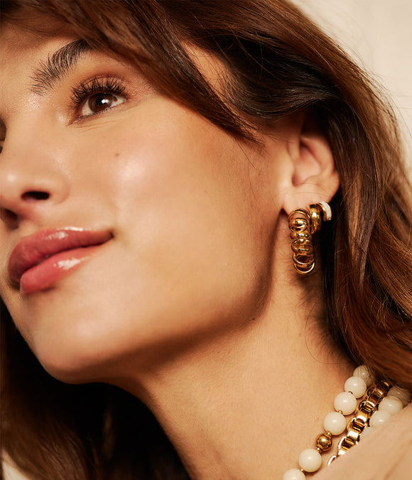 Boucles d'oreilles créoles ZAG Swirl en acier doré