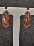 Créoles ZAG en acier doré et résine marron 880J798